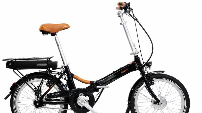 Vitali TOUR Retro Sondermodell Elektroklapprad bei E-Bike Mott Vitali TOUR Retro Sondermodell Elektroklapprad mit Ledergriffen, braunem Sattel und großem 690-Wh-Akku bei E-Bike Mott in Lauda
